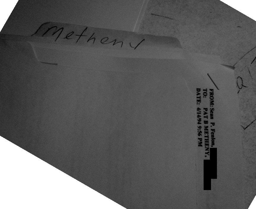 A manila file folder with “Metheny” handwritten on the tab, holding the printout of Sean's April 14, 1994 message