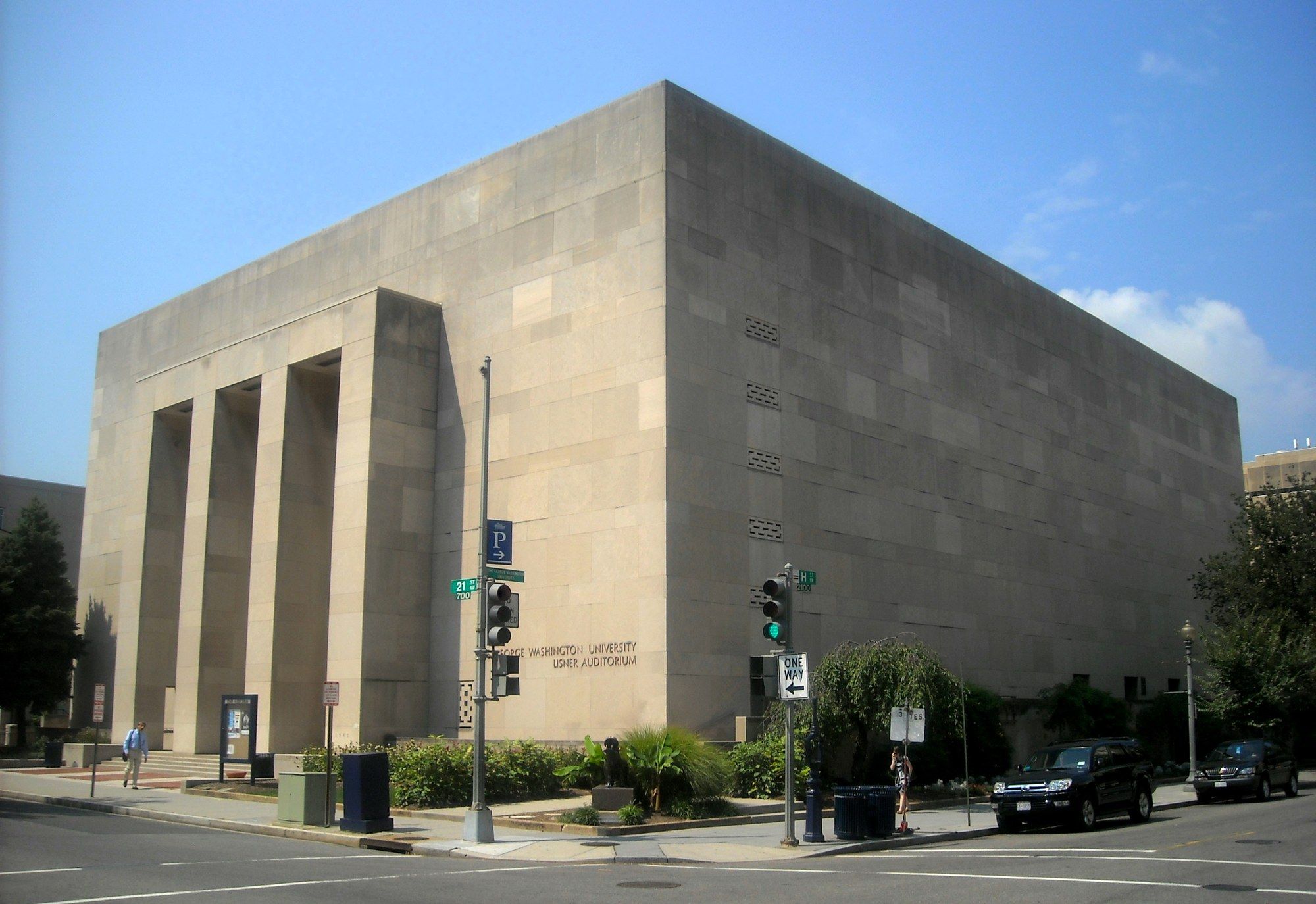 Exterior of Lisner Auditorium, a pale stone building on a Washington, DC street corner