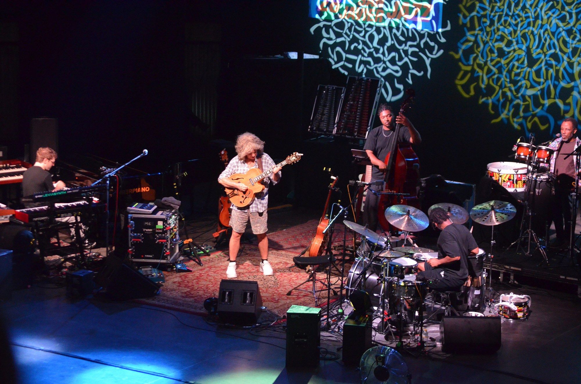 Wide view of the Side-Eye III stage at the San Javier Jazz Festival, with Pat Metheny and the band under colored light